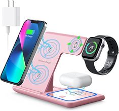 an apple watch and charging station with two phones