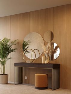 a living room with some plants and mirrors on the wall