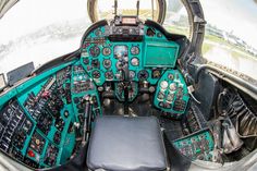 the cockpit of an airplane with many instruments