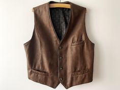 Vintage Vegan leather men's vest, brown loden waistcoat, Bavarian Austrian Oktoberfest clothing, country style vest, XL Large size  Label size: GB 48 / F 118 Measurements: Length: 28" Pit to pit: 25.5" Please check measurements to insure a proper fit. Remember to allow yourself some extra room for movement. You can compare these with something from your closet that fits you well. Condition: Good Vintage Condition with some signs of use (please see photos). SHIPPING * I ship worldwide via Priorit Fitted Brown Winter Vest, Fitted Western Style Winter Vest, Fitted Western Vest For Winter, Brown Hunting Vest With Pockets, Western Style Brown Vest For Fall, Western Brown Vest For Fall, Brown Western Vest For Fall, Brown Vest Men, Oktoberfest Clothing