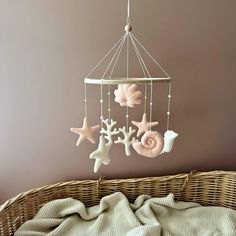 a baby crib with some decorations hanging from it