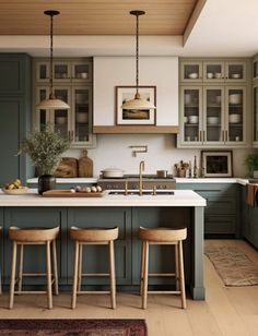 a kitchen with green cabinets and wooden stools