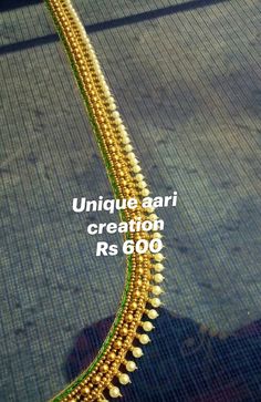 an image of a gold necklace with pearls and beads on the bottom, along with words that read unique aari creation rs 600