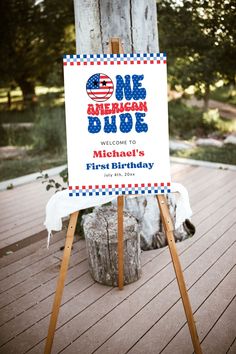 a sign that says one american dude welcomes michael's first birthday with an american flag on it