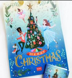 a merry christmas card with an image of a tree and two children's pictures