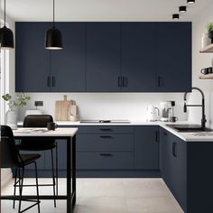 a kitchen with dark blue cabinets and white counter tops, black bar stools and hanging lights