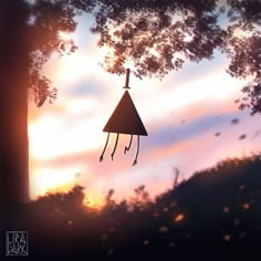 an upside down clock hanging from the side of a tree in front of a sunset