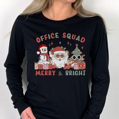 Office Staff Christmas Shirt makes the perfect shirt for the School Office or Admin crew fthis holiday season! T-shirt: This is made with a Gildan 64000 unisex soft-style t-shirt. Made from very soft materials, this tee is 100% cotton for solid colors. Heather colors and sports grey include polyester. The shoulders have twill tape for improved durability. There are no side seams. The collar is made with ribbed knitting to prevent curling damage. *100% ring-spun cotton *Light fabric *Tear-away la Office Christmas Shirts, Office Staff, Holiday Apparel, Squad Shirt, Everyday Items, School Office, Cotton Lights, Christmas Christmas, Christmas Shirt