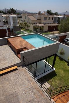 an aerial view of a house with a swimming pool