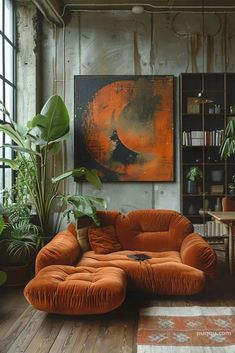 a living room with an orange couch and potted plants in the corner, along with a large painting on the wall