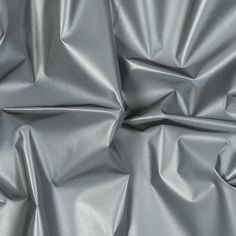 an up close shot of a shiny silver fabric