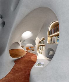 the interior of an unusual house with bookshelves