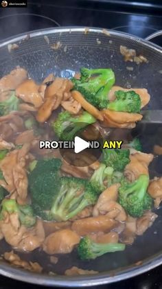 broccoli and mushrooms are being cooked in a wok on the stove top