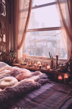 a bed in front of a window filled with candles