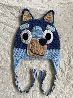 a crocheted hat with eyes and ears