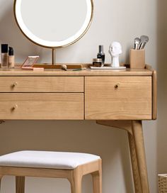 a wooden desk with a mirror and stool