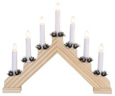 a set of seven candles with pine cones and spikes on each candle holder, in the shape of a triangle