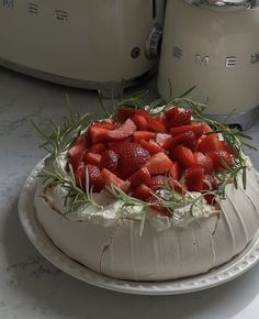 there is a cake with strawberries on it