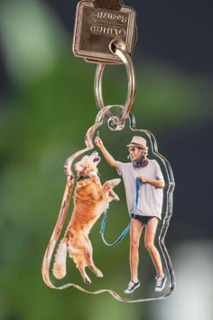 a keychain with a photo of a person and a dog hanging from it