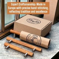 a pair of cork grips next to a cardboard box with the words expert craftsmanship made in europe with precision hand - stitching, reflecting tradition and excellence