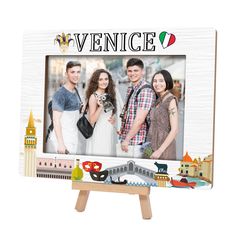 a wooden easel with an image of three people and a cityscape on it