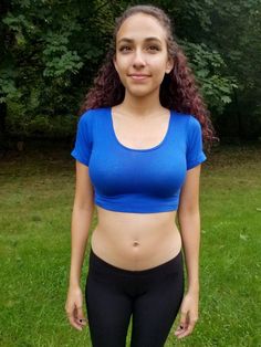 "This short sleeve form-fitting blue crop top is made from a stretchy cotton spandex fabric.   Worn With: Our Black Ultra Low Rise Capri Leggings. The model is 5'5\" and wearing a size small.  Size Chart (inches):                              S            M           L Bust                  26-30   30-34     34-36 Natural Waist  23           24            26 Length                12             13     14  Materials:  95% cotton, 5% spandex. Custom print on this crop top: Yes. You can request your own design on this crop top. There is a $16 custom design fee added to the price of the top. Local Pickup Available: Yes.  If you live in the south bay area in San Diego, you can pick up your crop top and receive up to 20%off.  Payment will be due on pickup. Country of Manufacture: Made in Califor Sporty Fitted Crop Top T-shirt, Basic Cropped Short Sleeve T-shirt For Workout, Basic Cropped T-shirt For Workout, Fitted Sporty Scoop Neck Crop Top, Stretch Cotton Sports Crop Top, Sporty Scoop Neck Crop Top, Stretch Cotton Crop Top For Sports, Blue Fitted Workout T-shirt, Stretch Scoop Neck Crop Top For Workout