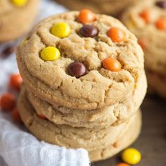 a stack of cookies with m & ms on top