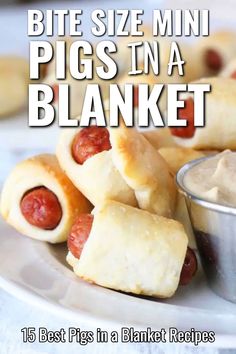 a white plate topped with pigs in a blanket