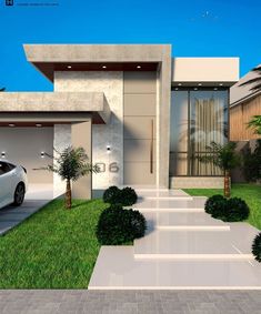 a white car parked in front of a modern house with grass and bushes around it