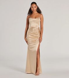 Simply stunning and beautiful is how you'll feel in the Jazmine satin formal dress perfect for weddings, bridesmaids, or fancy soirees! Made from a silky satin fabric, this gown offers a luxurious shine and sultriness to your evening look. She boasts delicate spaghetti straps and a cowl neckline, a flattering A-line silhouette designed with a front ruched seam atop a sexy high slit, and is finished with a floor-length hem. Complete the look with heels and sparkly earrings.Fit & FeaturesSatin Gold Long Dress, Homecoming Inspo, Orange Homecoming Dresses, Purple Homecoming Dress, Backless Dress Short, Satin Formal Dress, Green Homecoming Dresses, White Homecoming Dresses, Satin Homecoming Dress