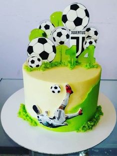 a soccer themed birthday cake is on display