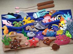 there are many different sea animals on the board together, including dolphins and fish in the ocean