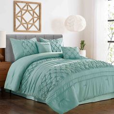 the comforter in this bedroom is aqua blue