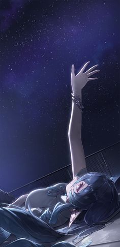 a woman laying on top of a bed under a sky filled with stars