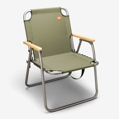 a green lawn chair sitting on top of a white floor