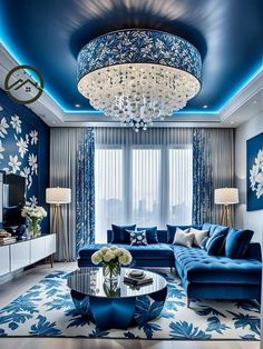 a living room with blue couches and chandelier in the middle of it