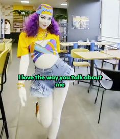 a mannequin with purple hair wearing a yellow shirt and blue skirt in a restaurant