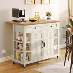 a kitchen island with two shelves and a microwave on top, in front of a dining room table