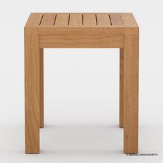 a small wooden table sitting on top of a white floor