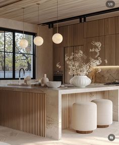 a kitchen with marble counter tops and white stools