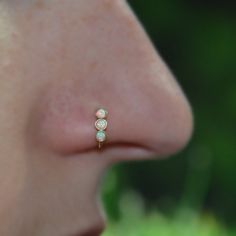 a close up of a person with a nose piercing