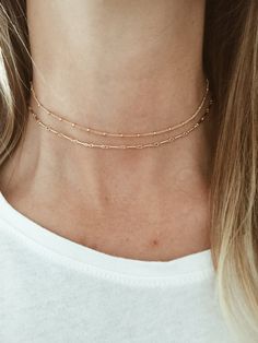 "This is a beautiful, simple and delicate choker featuring a gold beaded curb chain. It is all made out of 14/20 gold-fill. You get to customize the length of your choker to ensure that it lays where you would like on your neck. Pictured here is 13.5\". If you need a different length, please leave me a note at checkout requesting the length you need. This necklace can be worn alone or is perfect for layering, as it is shown here with our... Gold Circle Choker: https://www.etsy.com/listing/459358 Minimalist Gold Chain Choker Layered Necklace, Trendy Gold Choker With Tiny Beads, Trendy Gold Beaded Chain Choker, Minimalist 14k Gold Filled Choker, Dainty Gold Chain Choker, Minimalist Gold Choker With Satellite Chain, Minimalist 14k Gold Filled Choker Chain Necklace, Minimalist Gold Chain Choker For Everyday, Minimalist 14k Gold Filled Chain Choker