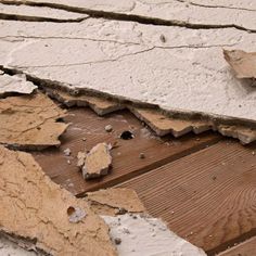 the wood floor has been chipped and cracked