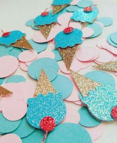 blue and pink ice cream cones with glitter on them