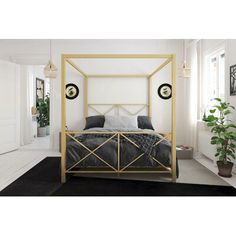 a bedroom with white walls, black carpet and a gold bed frame in the middle