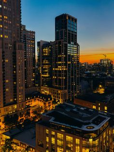 the city is lit up at night and it's lights shine brightly on the buildings