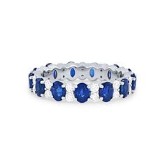 a white gold ring with blue sapphires and diamonds