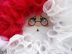 a doll with red hair and glasses on it's face is surrounded by white lace