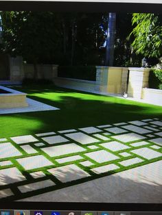 a computer screen with grass in the middle and white tiles on the bottom, as well as an artificial lawn