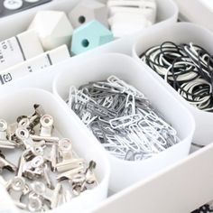 a drawer filled with lots of different types of screws and nails in it's drawers